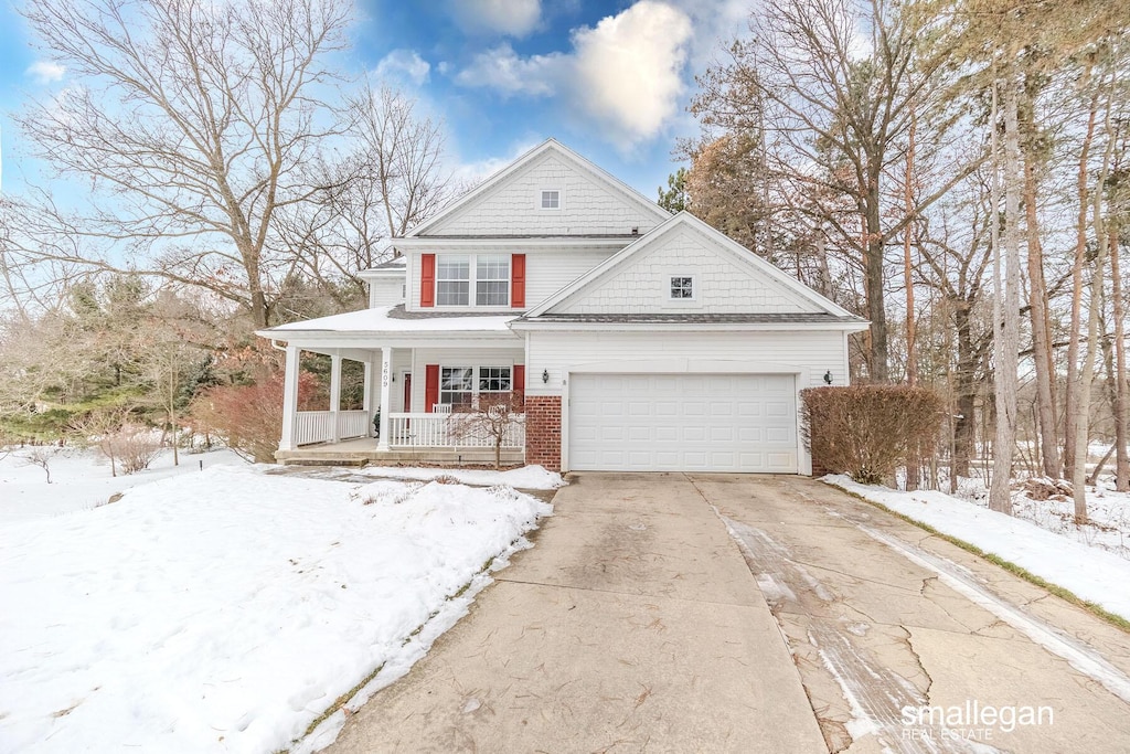 view of front of home with covered porch and a garage