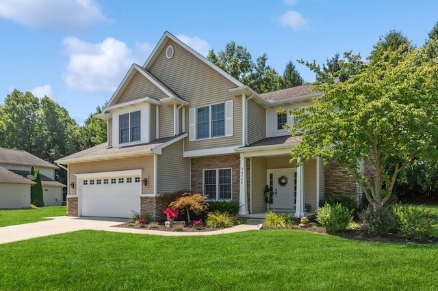 craftsman-style home with a garage, driveway, a front lawn, and stone siding