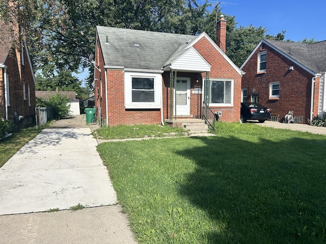 bungalow with a front yard