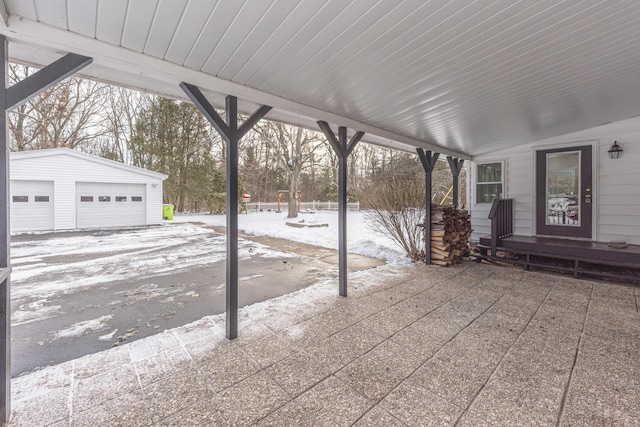 view of patio with a garage and an outdoor structure