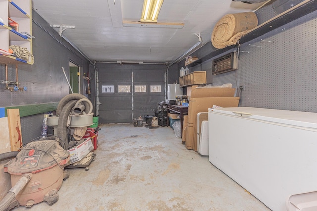 garage featuring fridge and gas water heater