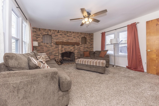 carpeted living room with a brick fireplace and ceiling fan