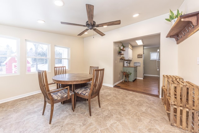 dining space with ceiling fan