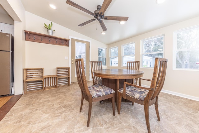 dining room featuring ceiling fan and vaulted ceiling