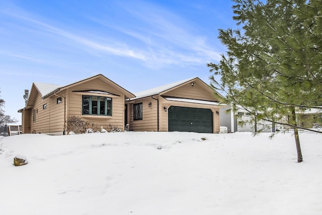 ranch-style house featuring a garage