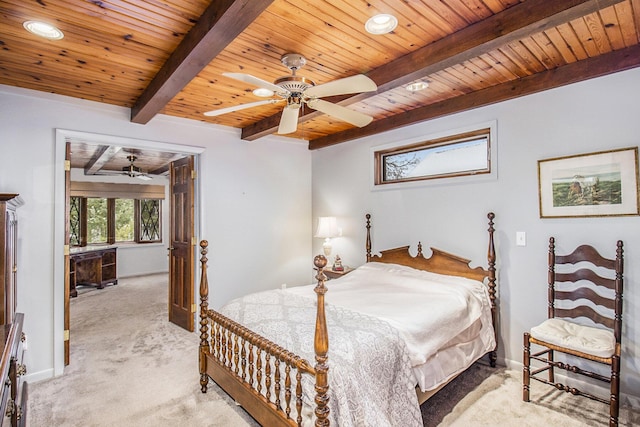 carpeted bedroom with ceiling fan, wooden ceiling, and beam ceiling