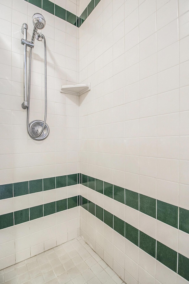 bathroom with tiled shower