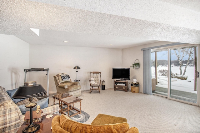 carpeted living room featuring a textured ceiling