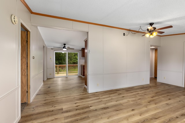 unfurnished living room with ceiling fan, light wood-type flooring, crown molding, and a textured ceiling