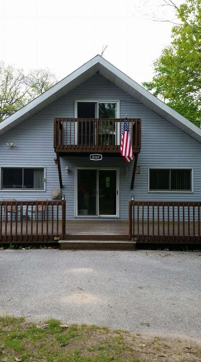 rear view of house with a balcony