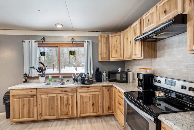 kitchen with tasteful backsplash, electric stove, light hardwood / wood-style flooring, light stone counters, and sink