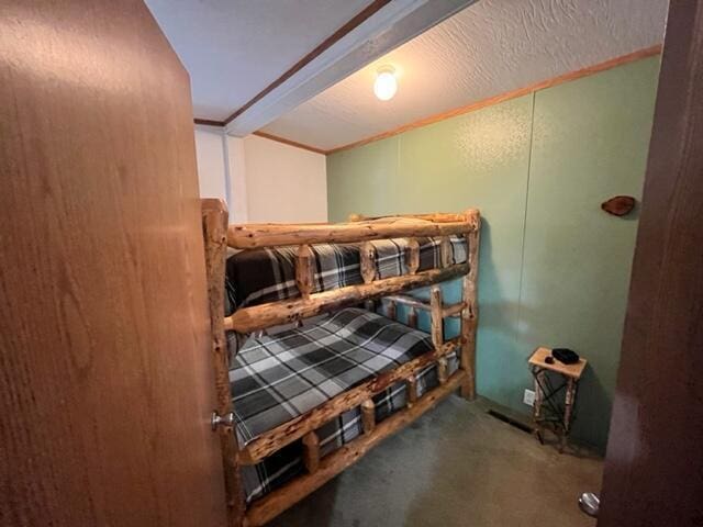 bedroom with crown molding