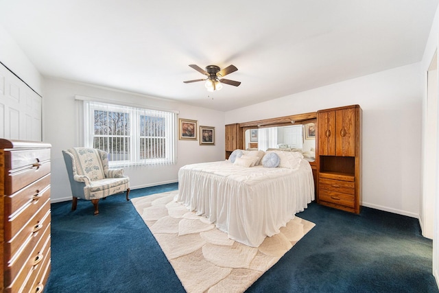 bedroom with ceiling fan and dark colored carpet