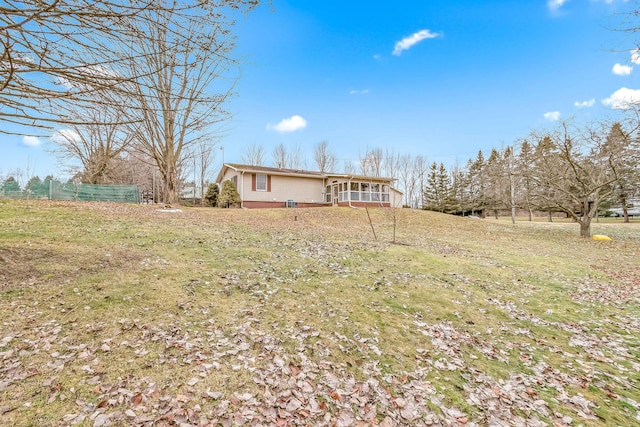 view of yard featuring a sunroom