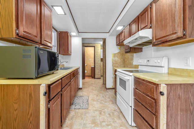 kitchen with white range with electric cooktop and sink