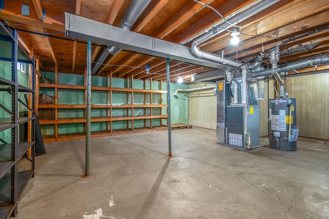 basement with gas water heater and heating unit