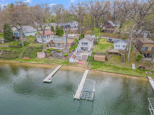 bird's eye view with a residential view and a water view