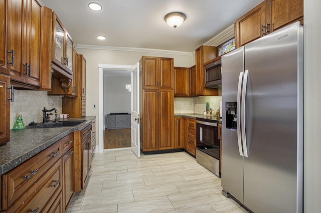 kitchen featuring light hardwood / wood-style floors, appliances with stainless steel finishes, sink, ornamental molding, and backsplash