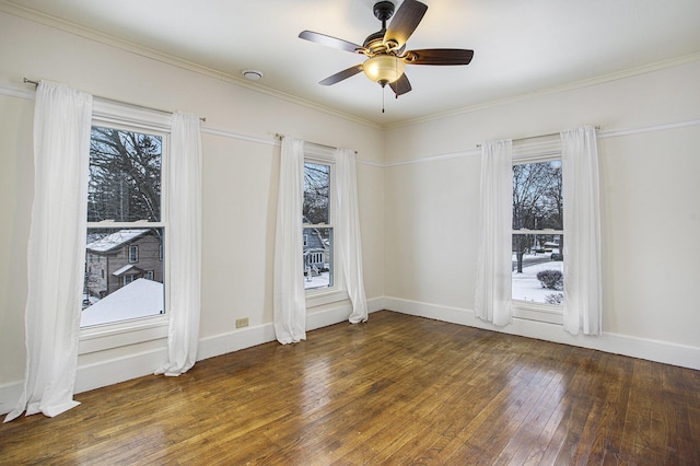 unfurnished room with ceiling fan, dark hardwood / wood-style floors, ornamental molding, and a healthy amount of sunlight