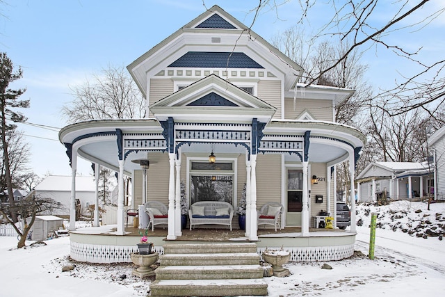 victorian house featuring a porch