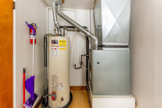 utility room with water heater and heating unit