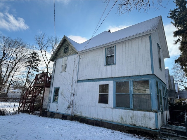 view of snow covered house