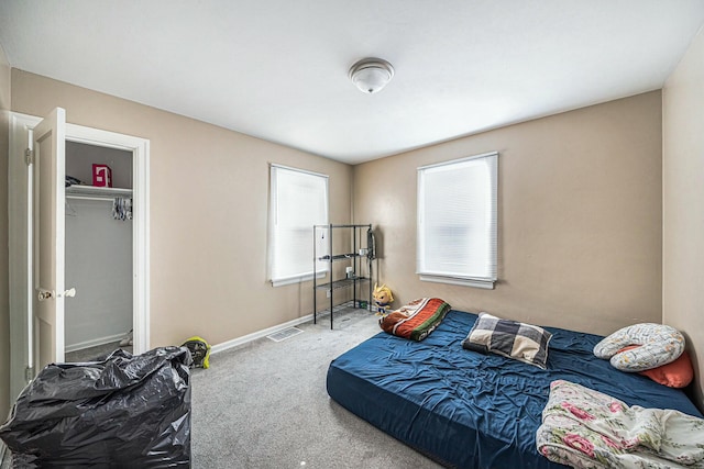 bedroom with a closet and carpet flooring