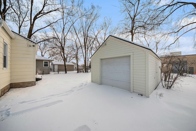 view of snow covered garage