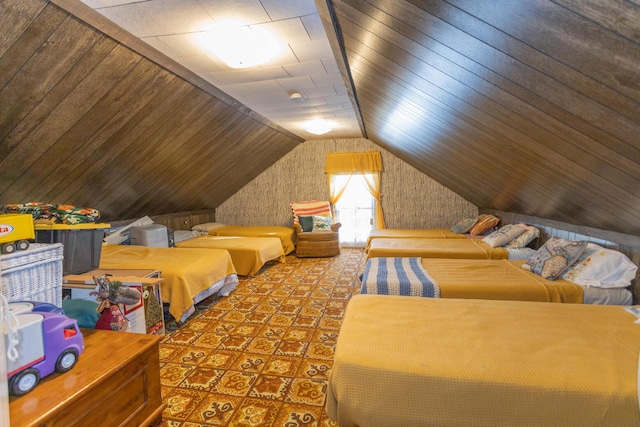 bedroom with lofted ceiling and wooden walls