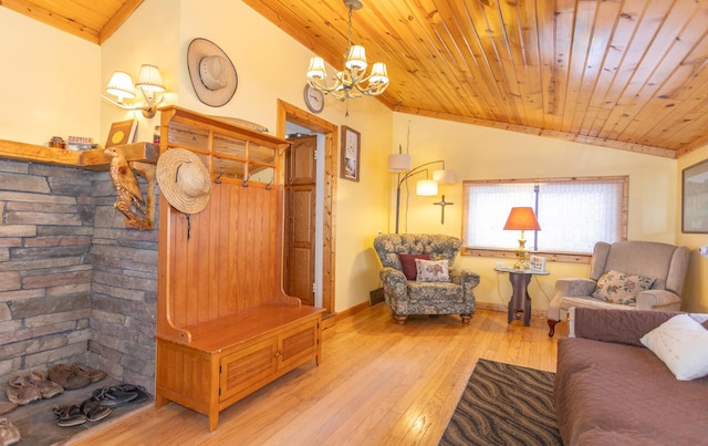 living room with light hardwood / wood-style flooring, a notable chandelier, vaulted ceiling, and wooden ceiling