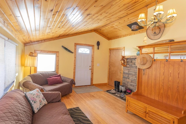 living room with wood ceiling, lofted ceiling, an inviting chandelier, and light wood-type flooring