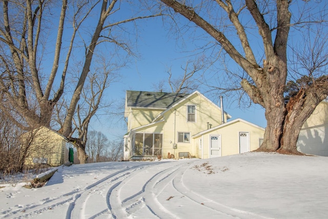 front facade with a sunroom