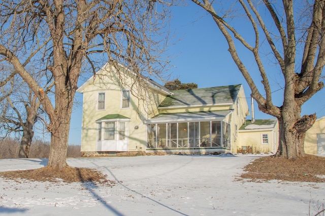 view of front facade featuring a sunroom