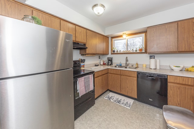 kitchen featuring black appliances and sink