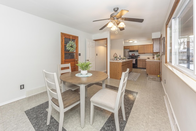 dining room with ceiling fan