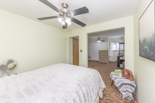 bedroom featuring ceiling fan, a closet, and carpet flooring