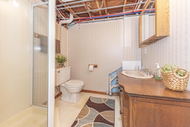 bathroom featuring a shower with shower door, toilet, and vanity