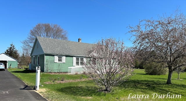 view of property exterior featuring a yard