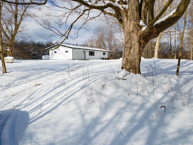 view of yard layered in snow