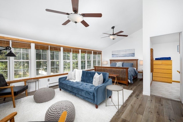 bedroom with ceiling fan, high vaulted ceiling, a baseboard radiator, and hardwood / wood-style flooring