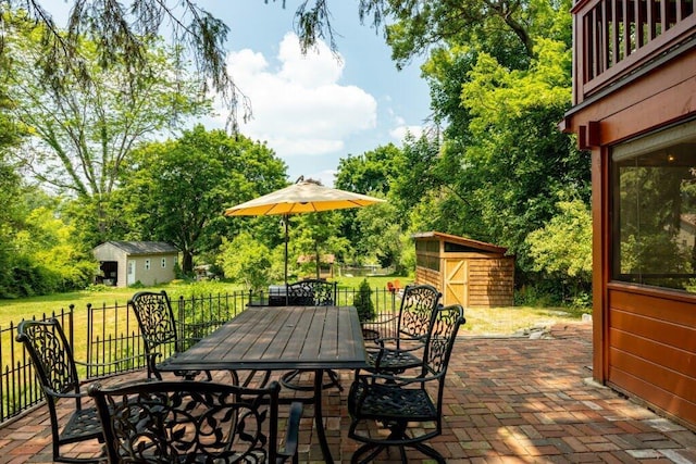 view of patio featuring a storage unit