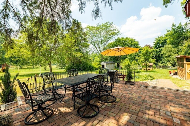 view of patio / terrace featuring a storage shed