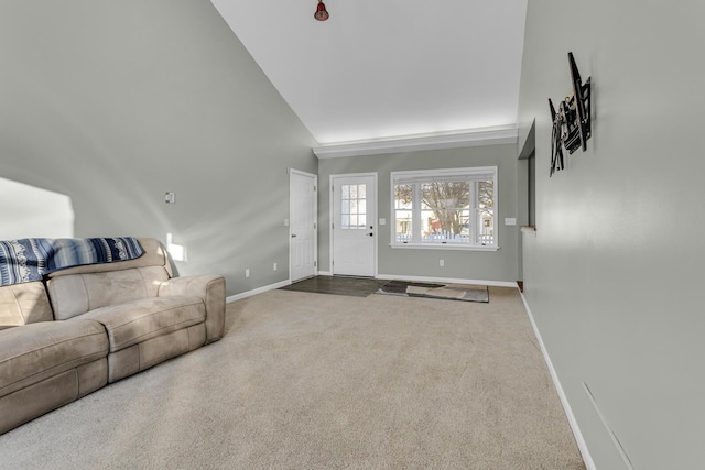 living room featuring carpet flooring and high vaulted ceiling