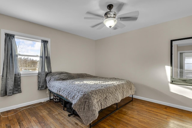 bedroom with ceiling fan and hardwood / wood-style floors