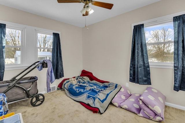 carpeted bedroom with ceiling fan