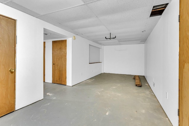 basement featuring a drop ceiling