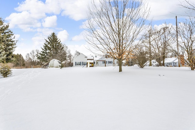 view of yard covered in snow