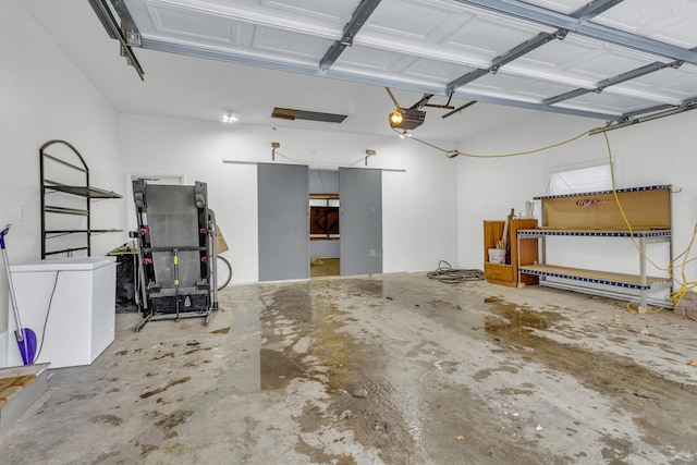 garage featuring a garage door opener and fridge