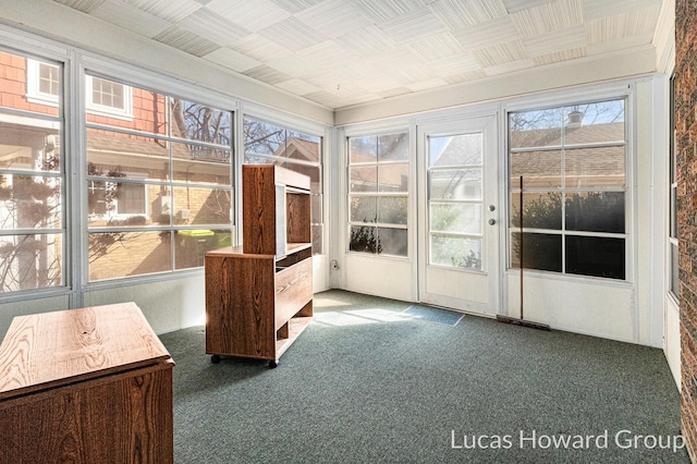 unfurnished sunroom featuring plenty of natural light