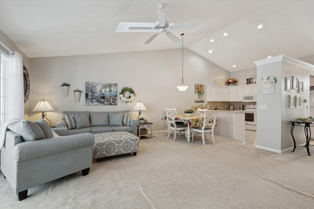 living room with ceiling fan, light carpet, and lofted ceiling